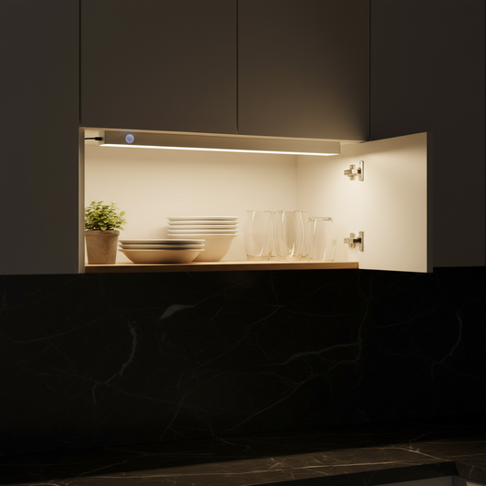 LED motion sensor light glowing inside kitchen cabinet